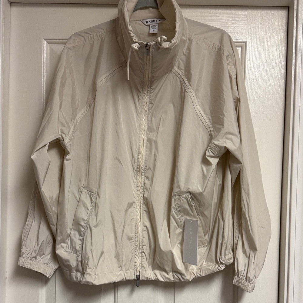 NWT Women’s Athleta Rise Jacket, Size M, light cream/khaki.